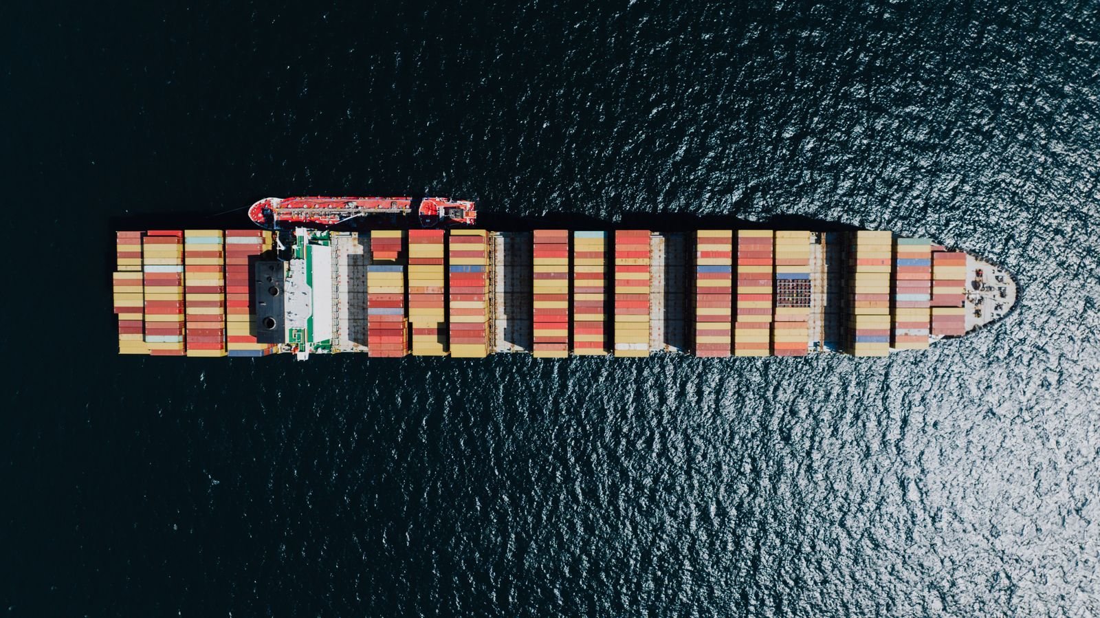 Aerial view of a loaded cargo ship in deep sea